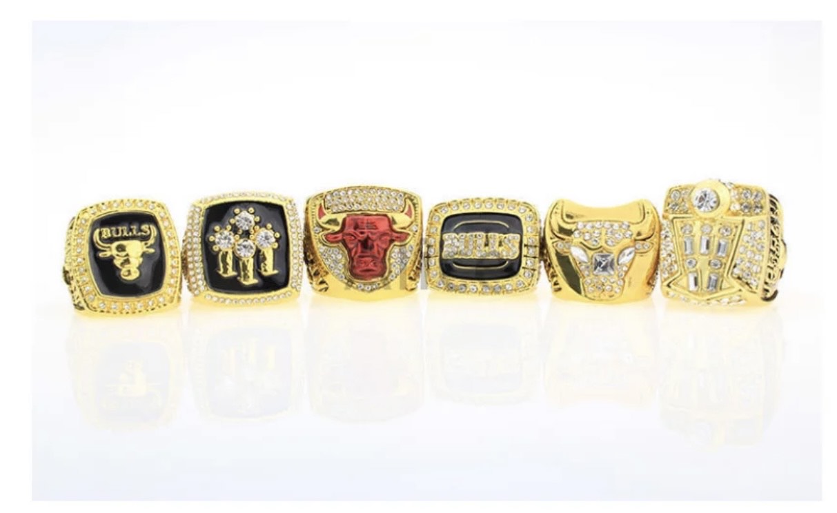 Six Chicago Bulls Championship rings, all exact replicas crafted by  Jostens, are part of a display produ…
